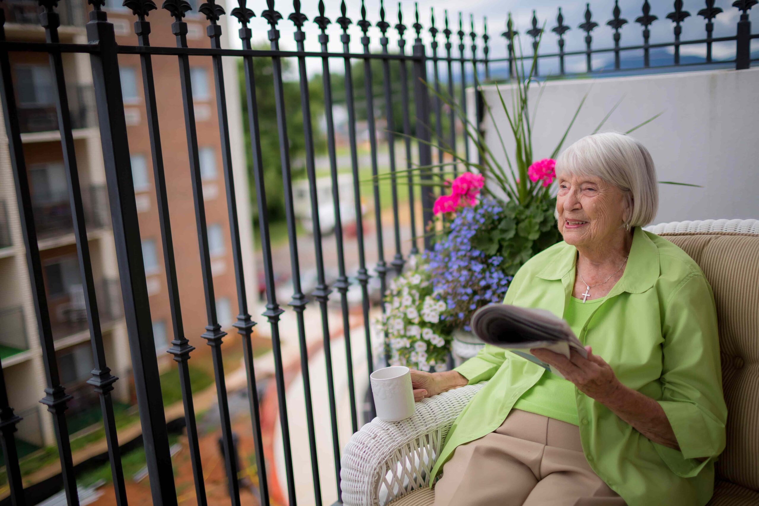 Senior resident enjoying a peaceful moment on a balcony