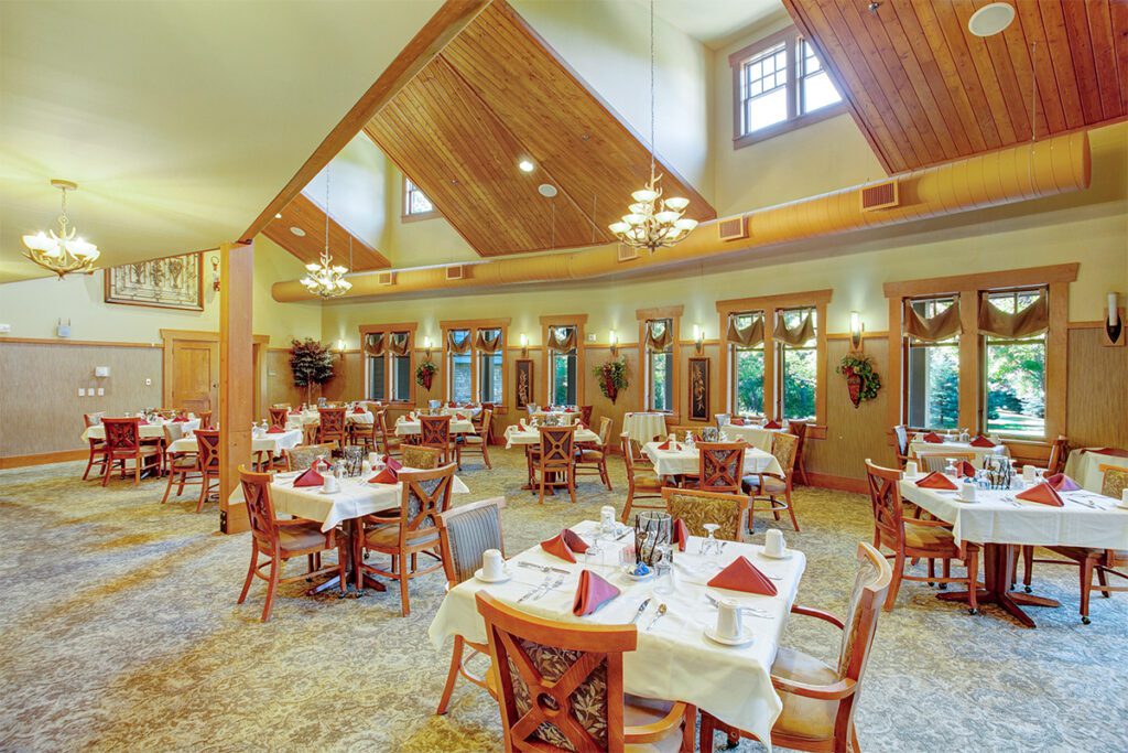 Dining room with tables set for residents