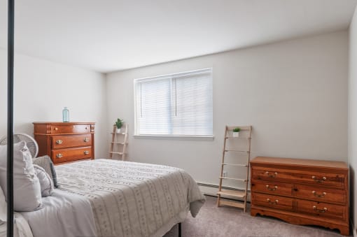 Cozy bedroom with wooden furniture and bright window