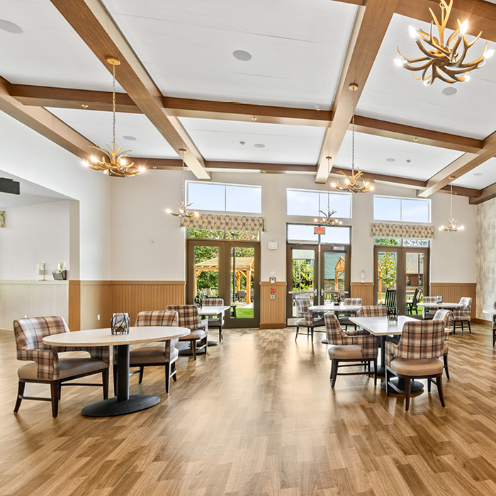 Bright dining room with large windows and elegant decor