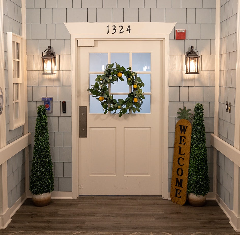 Welcoming entrance door with decorations and plants