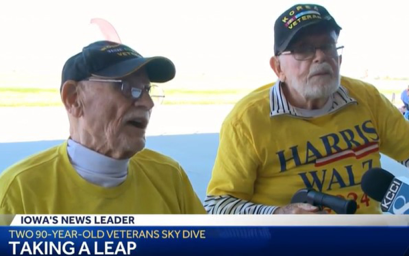 Two elderly veterans preparing for a sky dive