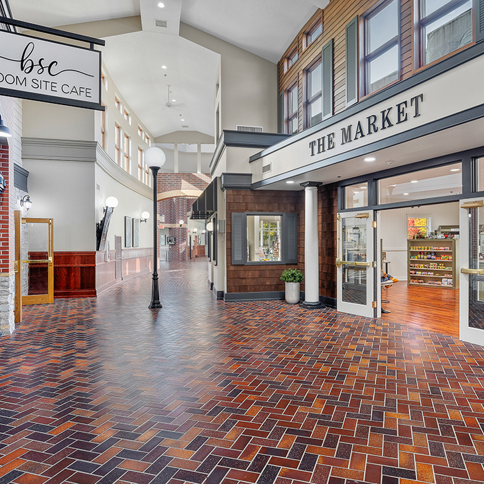 Interior view of a common area with cafe and market