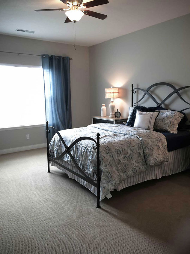 Cozy private resident room with a bed and decor