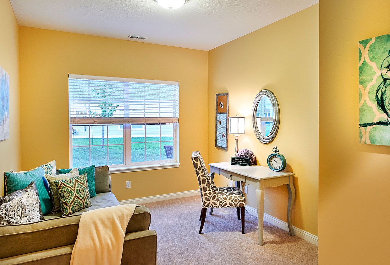 Cozy interior room with a desk and seating area