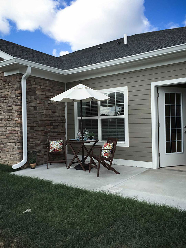 Outdoor seating area with a table and umbrella