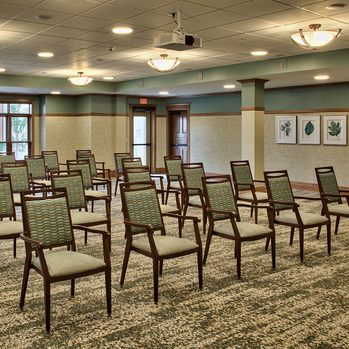 Empty activity room with arranged chairs
