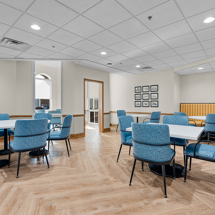 Bright common area with tables and chairs