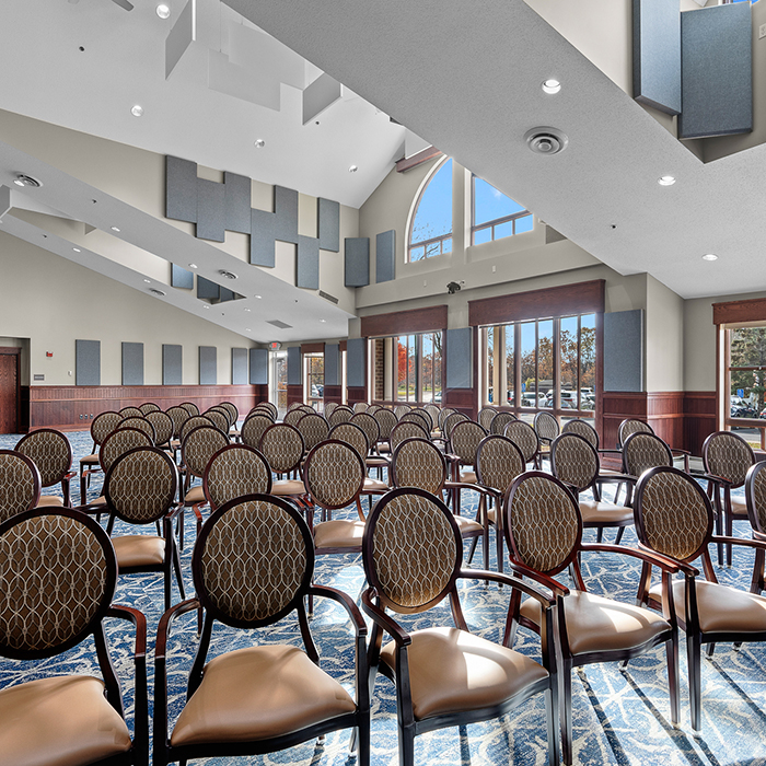 Interior view of a large room with empty chairs