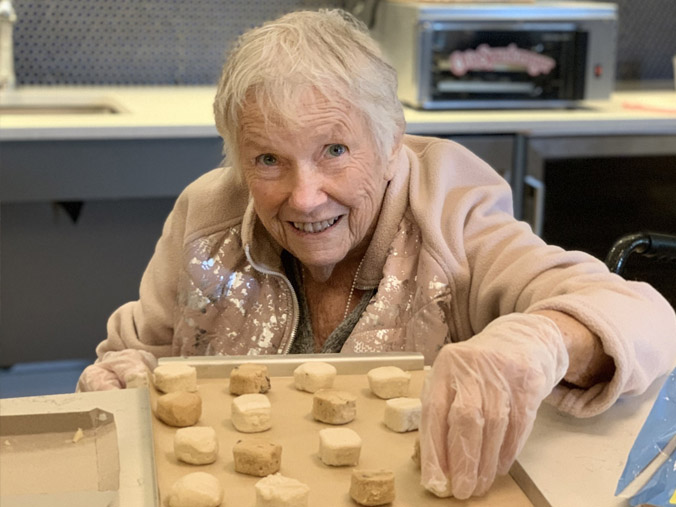 Resident actively baking in an interior kitchen