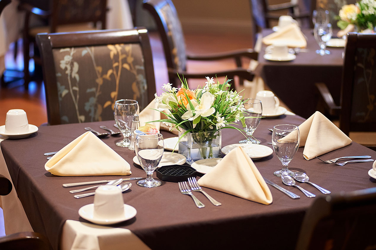 Well-set dining table with elegant decor and tableware