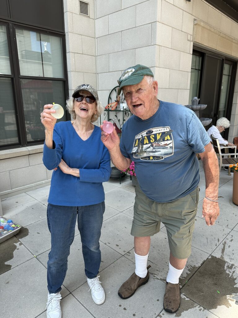 Residents enjoying a colorful outdoor activity.