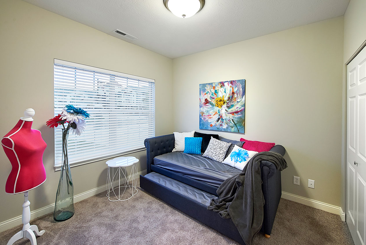 Cozy interior of a resident's room with a sofa and artwork
