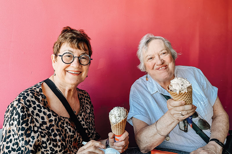 Two residents enjoying ice cream cones together