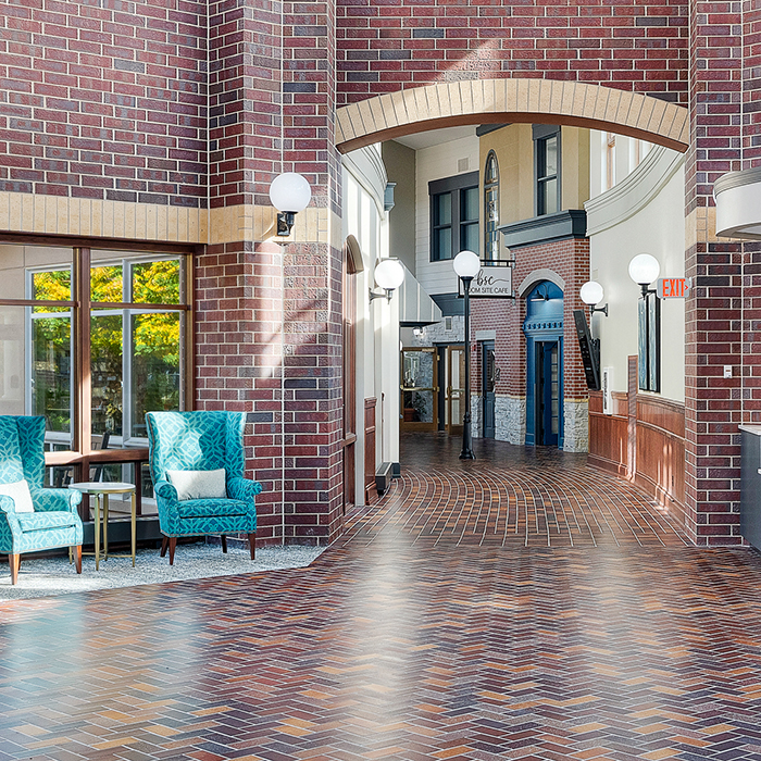 Bright interior corridor with seating area