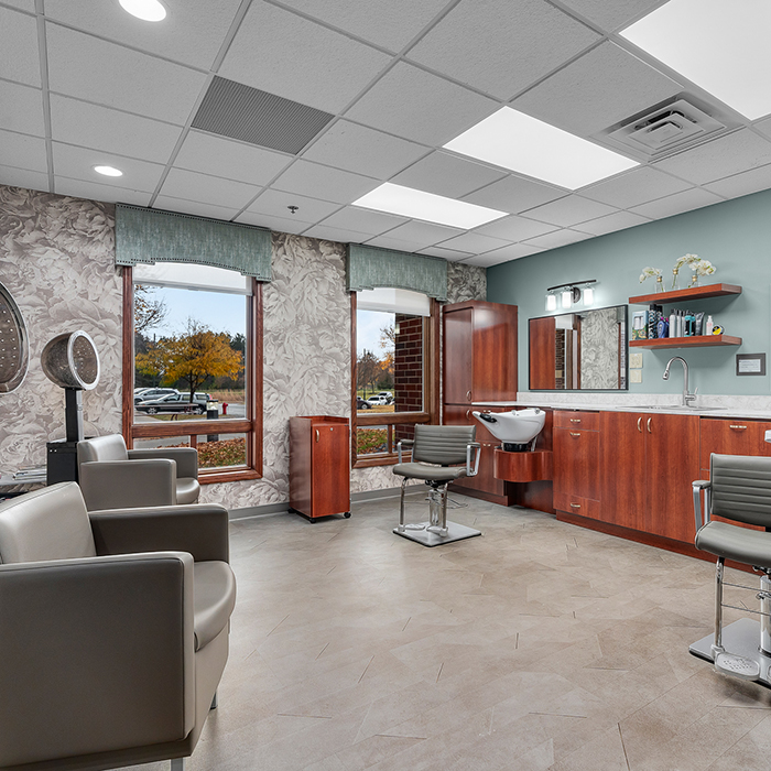 Interior of a salon area with styling chairs and mirrors