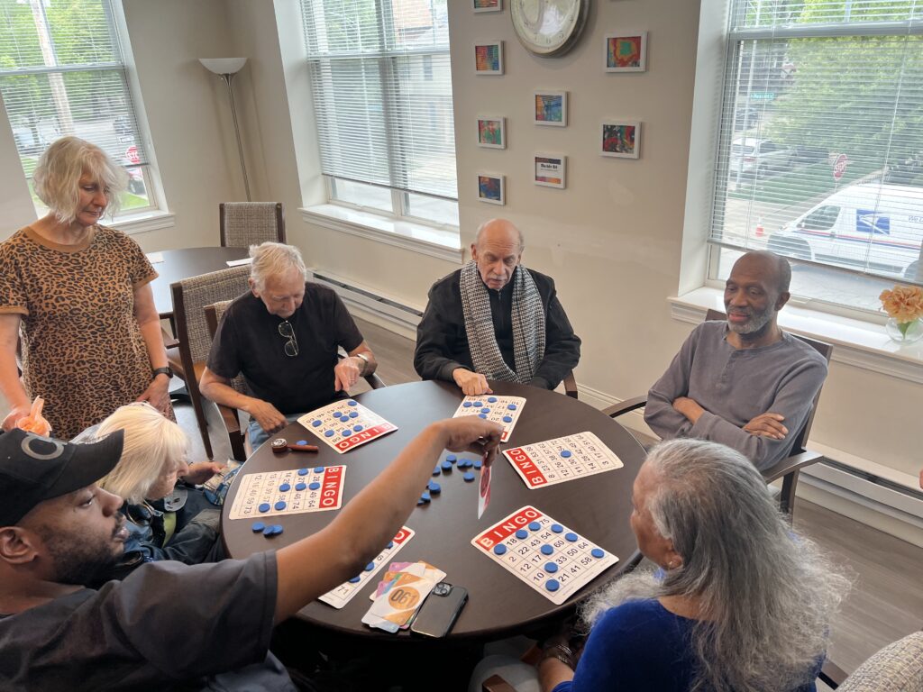 Residents enjoying a bingo game in a common area