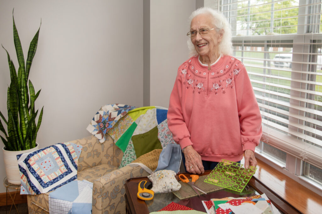 Resident crafting in a cozy interior setting