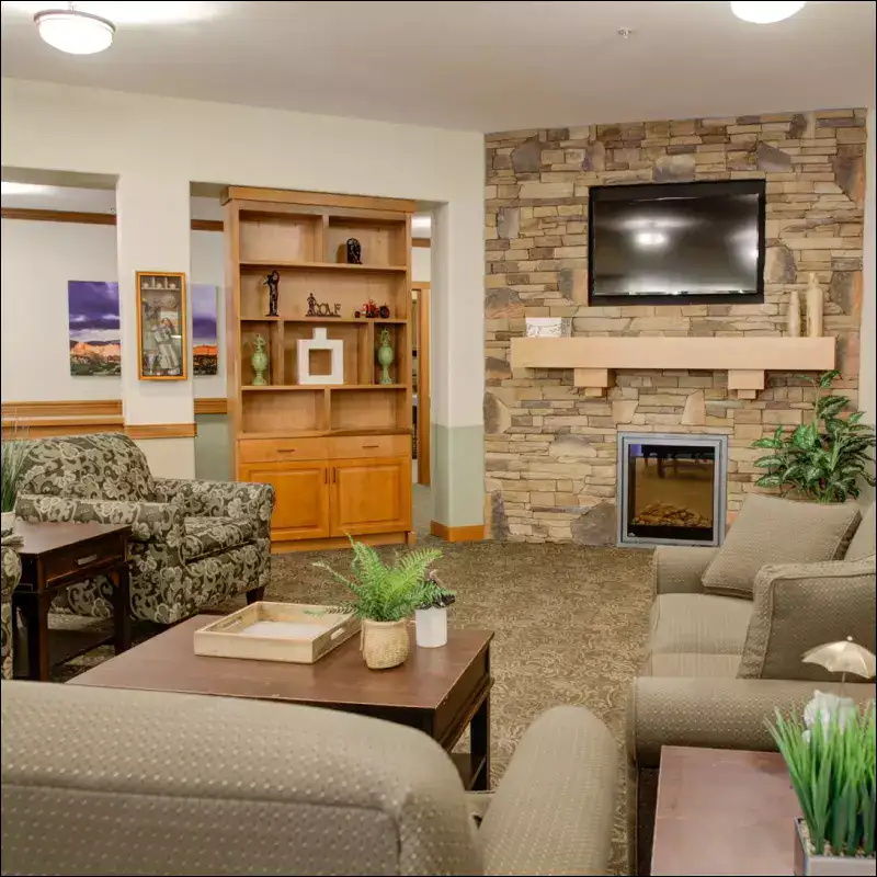 Cozy common area with seating and stone fireplace