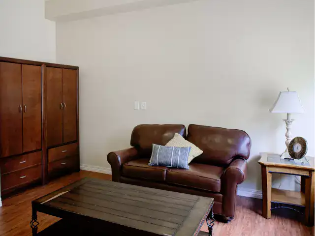 Interior view of a simple living area with a couch and table