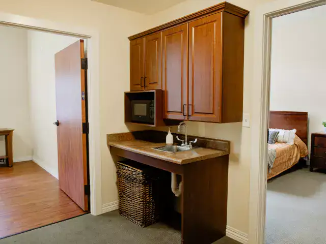 A private resident room with kitchenette area