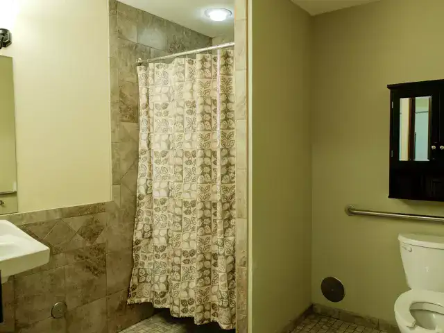A private bathroom with shower and toiletries
