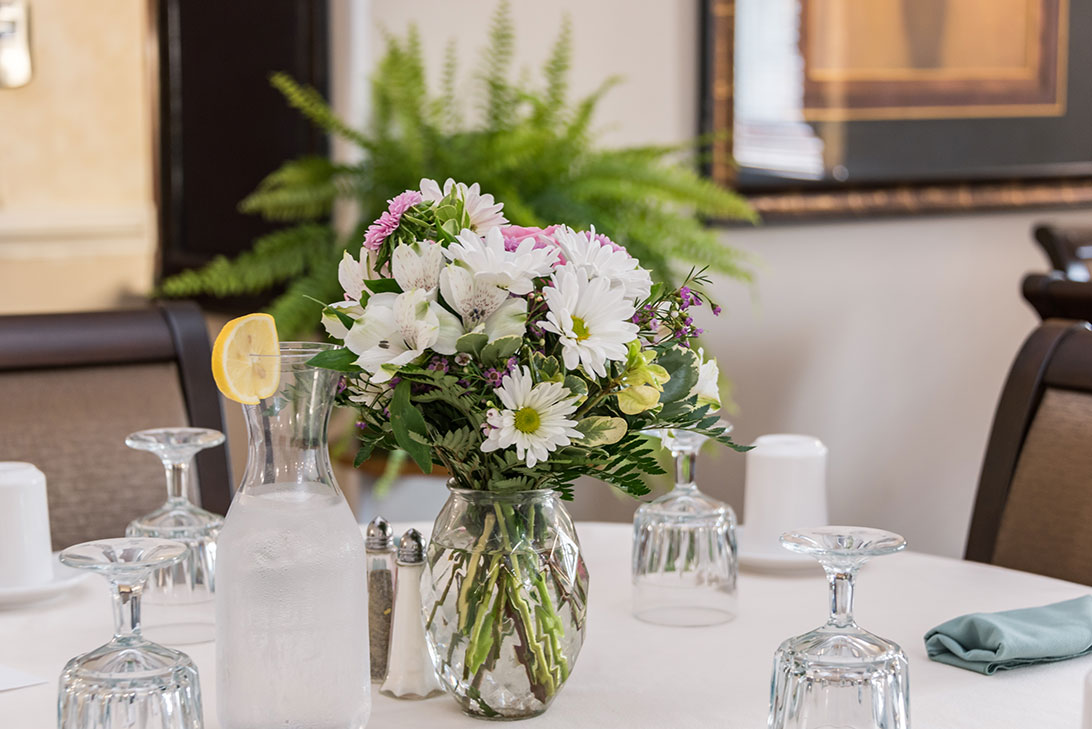 Table setting with flowers in the dining area