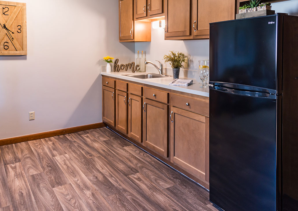 Interior kitchen space with cabinets and decor