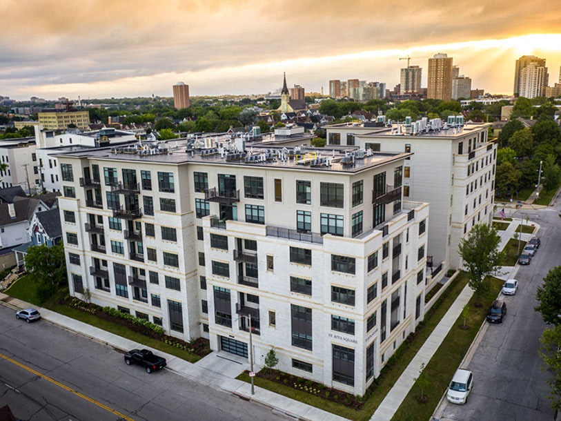 Aerial view of Wilson Commons building with city skyline