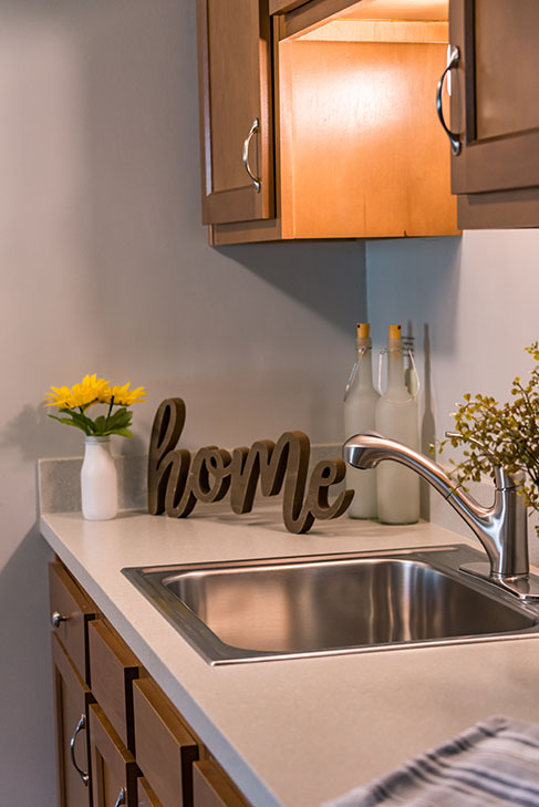 Well-lit kitchen area with decorative accents