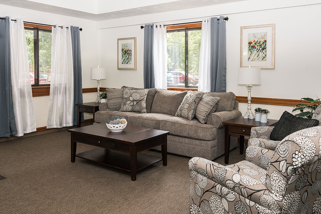 Cozy lounge area with a sofa and chairs