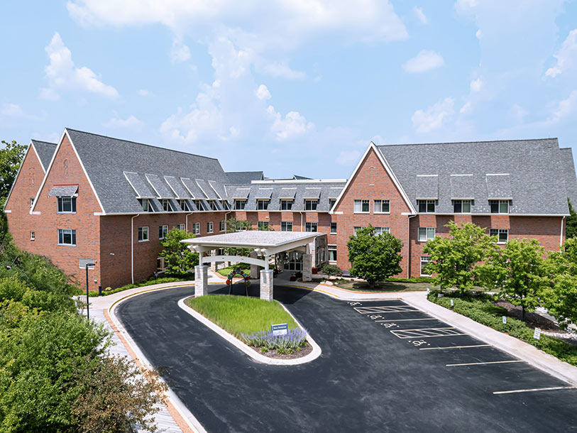 Exterior view of Wilson Commons building with landscaped entrance