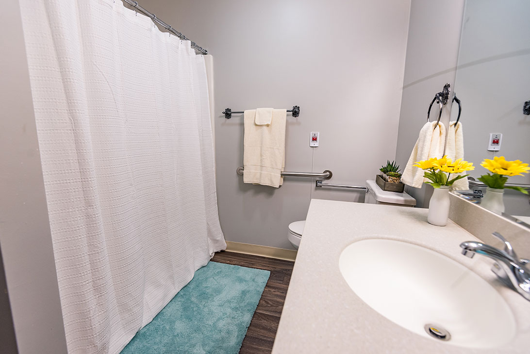Clean bathroom with shower and towels