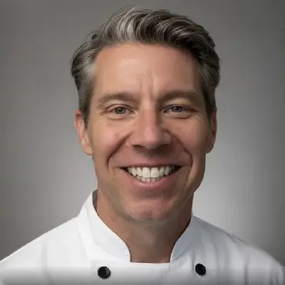 Smiling chef in a white uniform