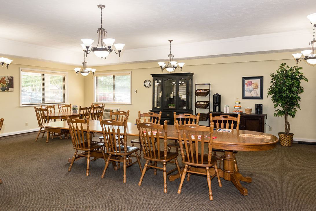 Dining area with wooden tables and chairs