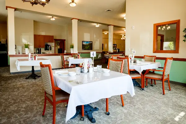 Dining room setup with tables and chairs