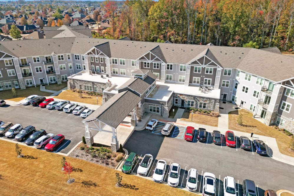 Aerial view of the facility with parking and buildings