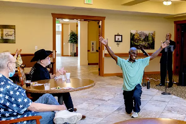 Residents enjoying a performance in a common area