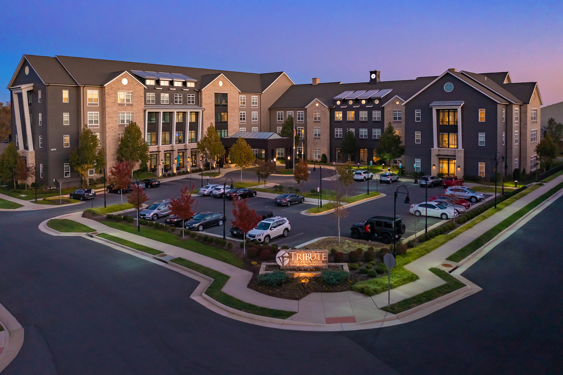 Aerial view of the facility exterior during twilight