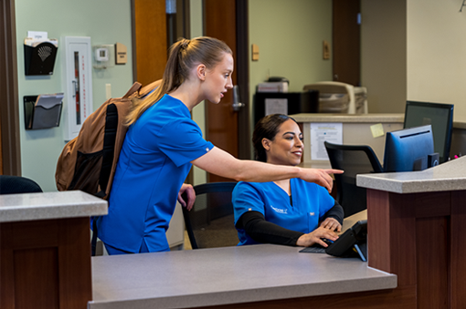 Nursing staff assisting at the reception desk