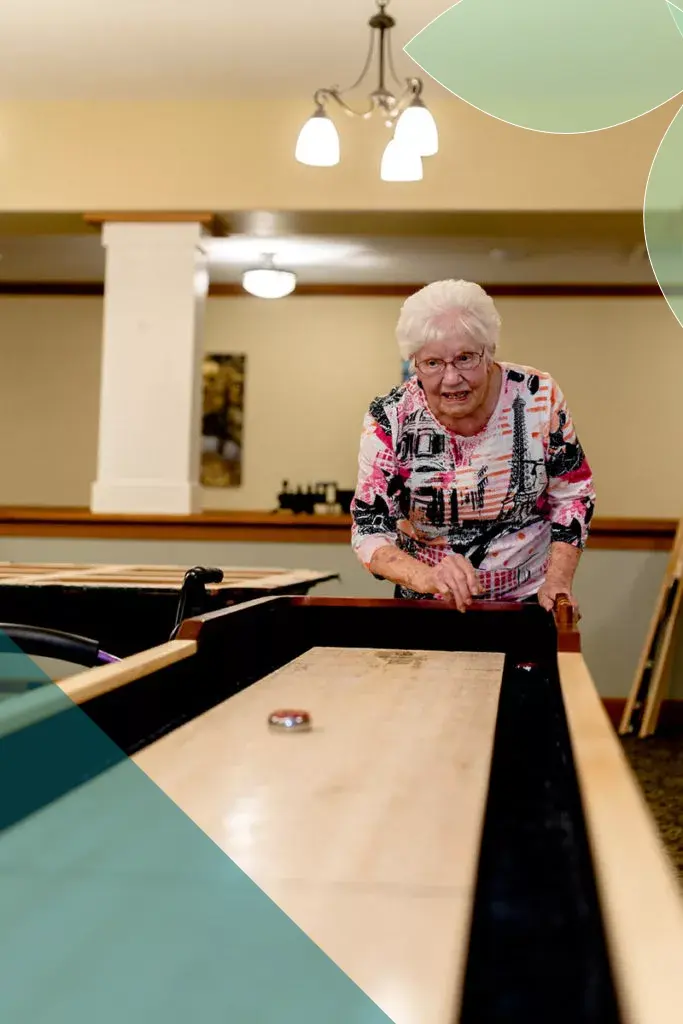 Resident enjoying a game indoors