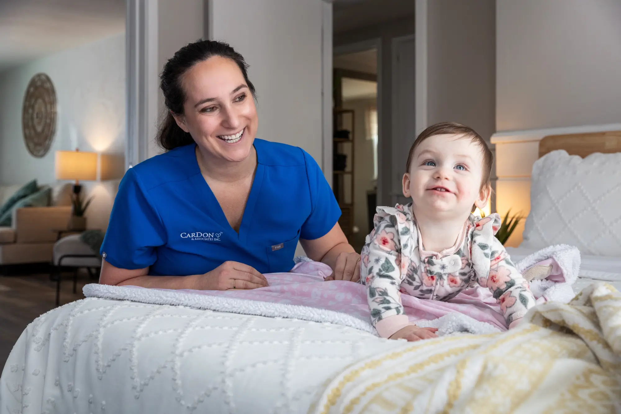 A caregiver playing with a child in a cozy room