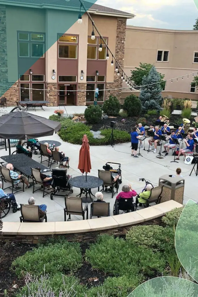 Residents enjoying a musical performance in the outdoor courtyard