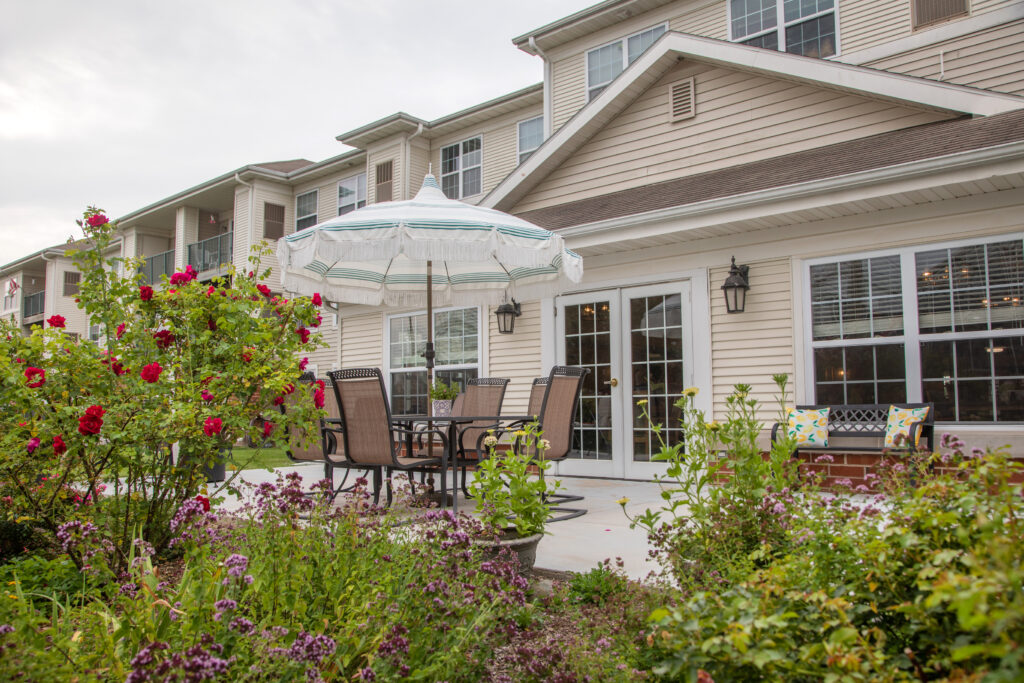 Outdoor patio area with seating and flowers