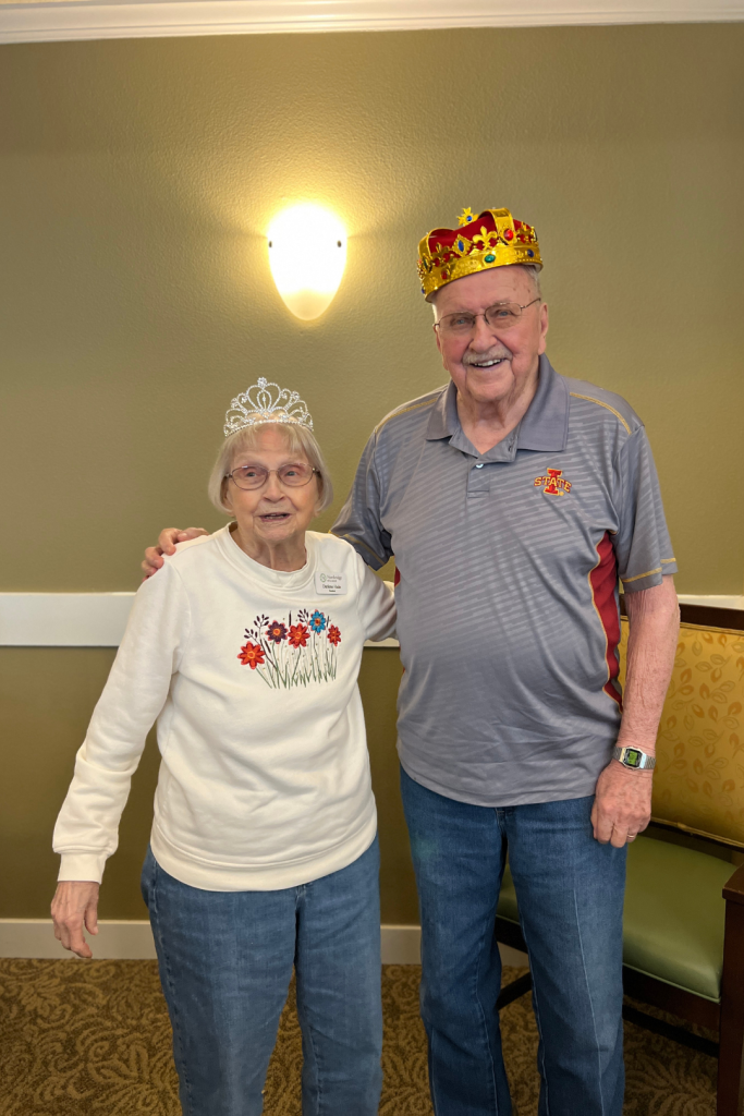Residents celebrating wearing crowns in a common area
