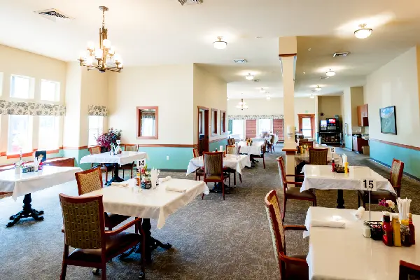 Dining room setup with tables and chairs