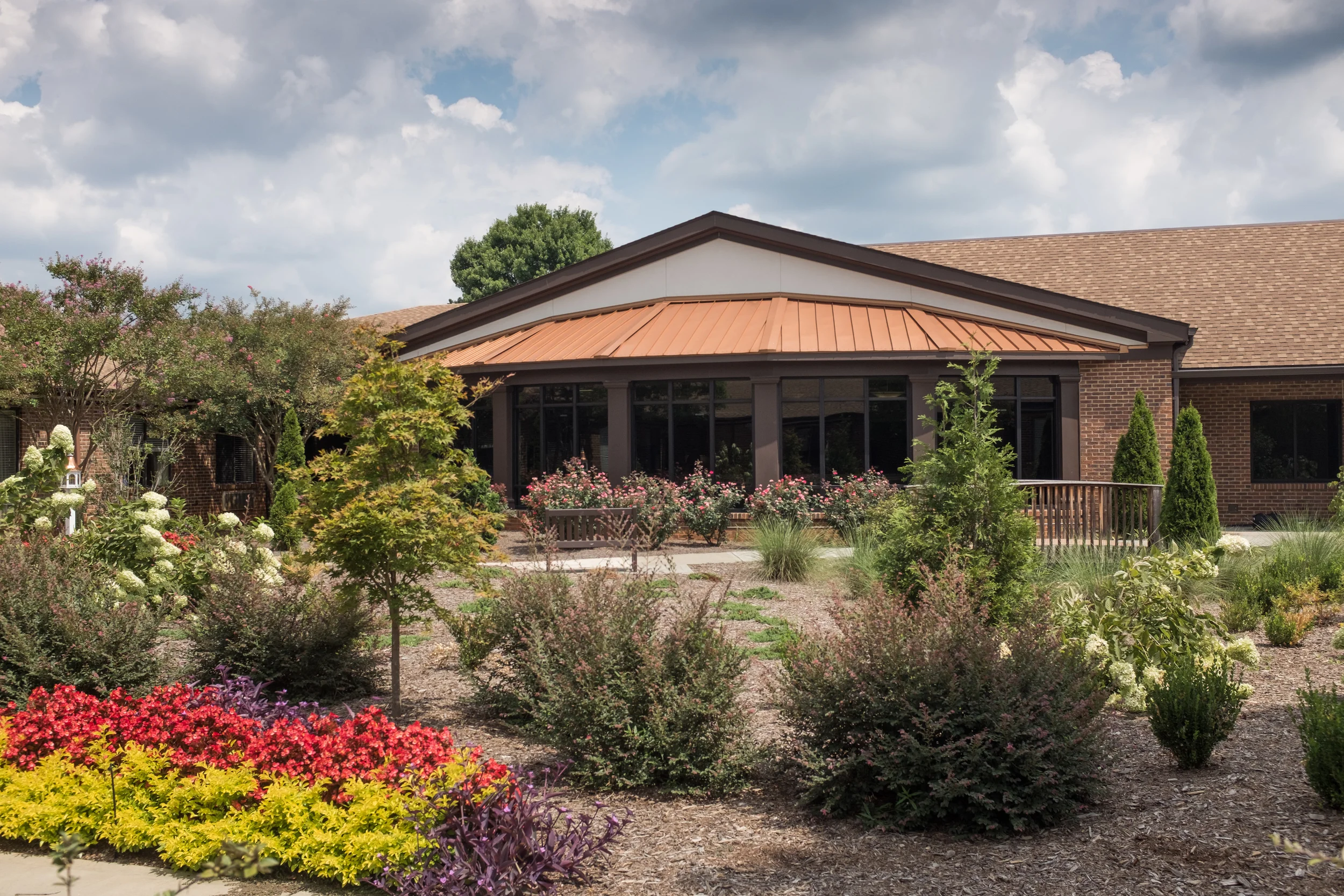 Exterior view of White Oak Manor Charlotte with landscaped gardens