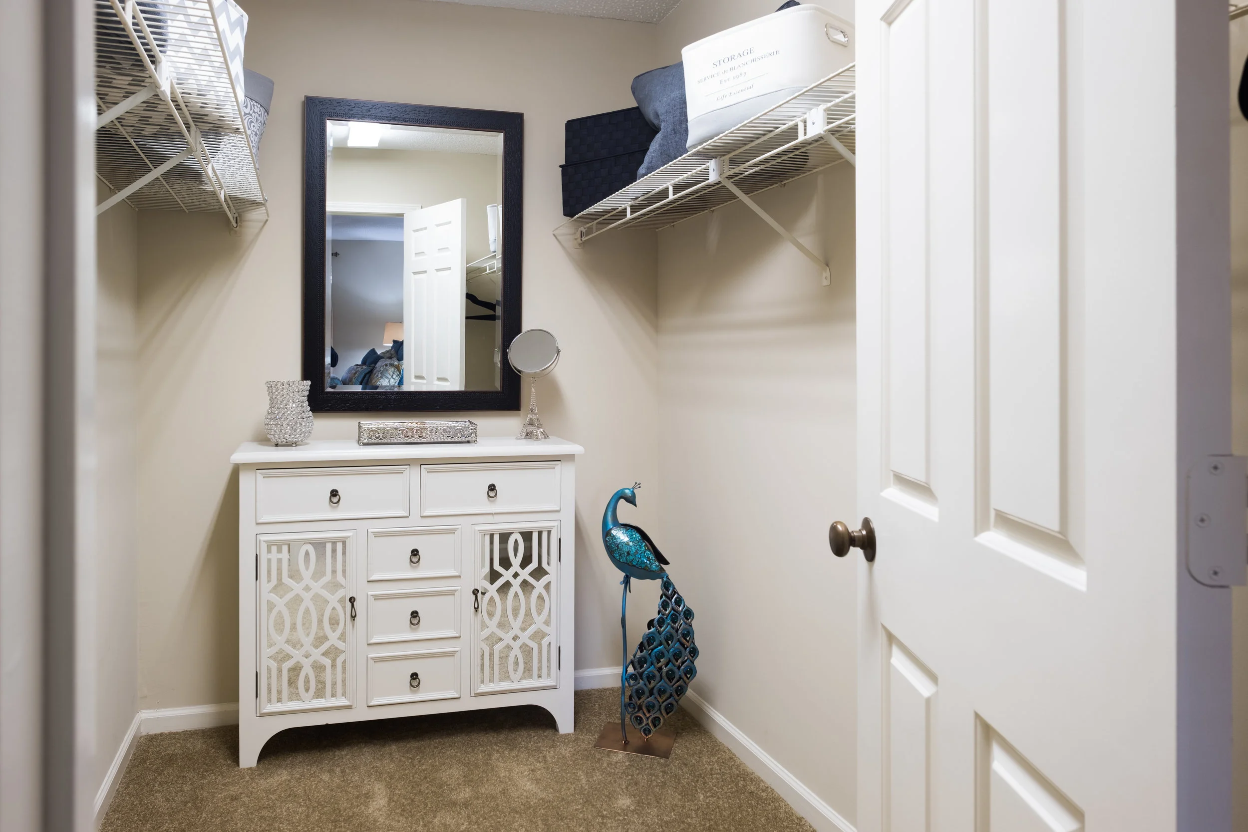 Interior space featuring a dresser and mirror