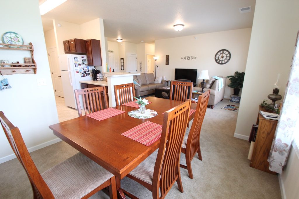 Cozy dining area with wooden table and chairs