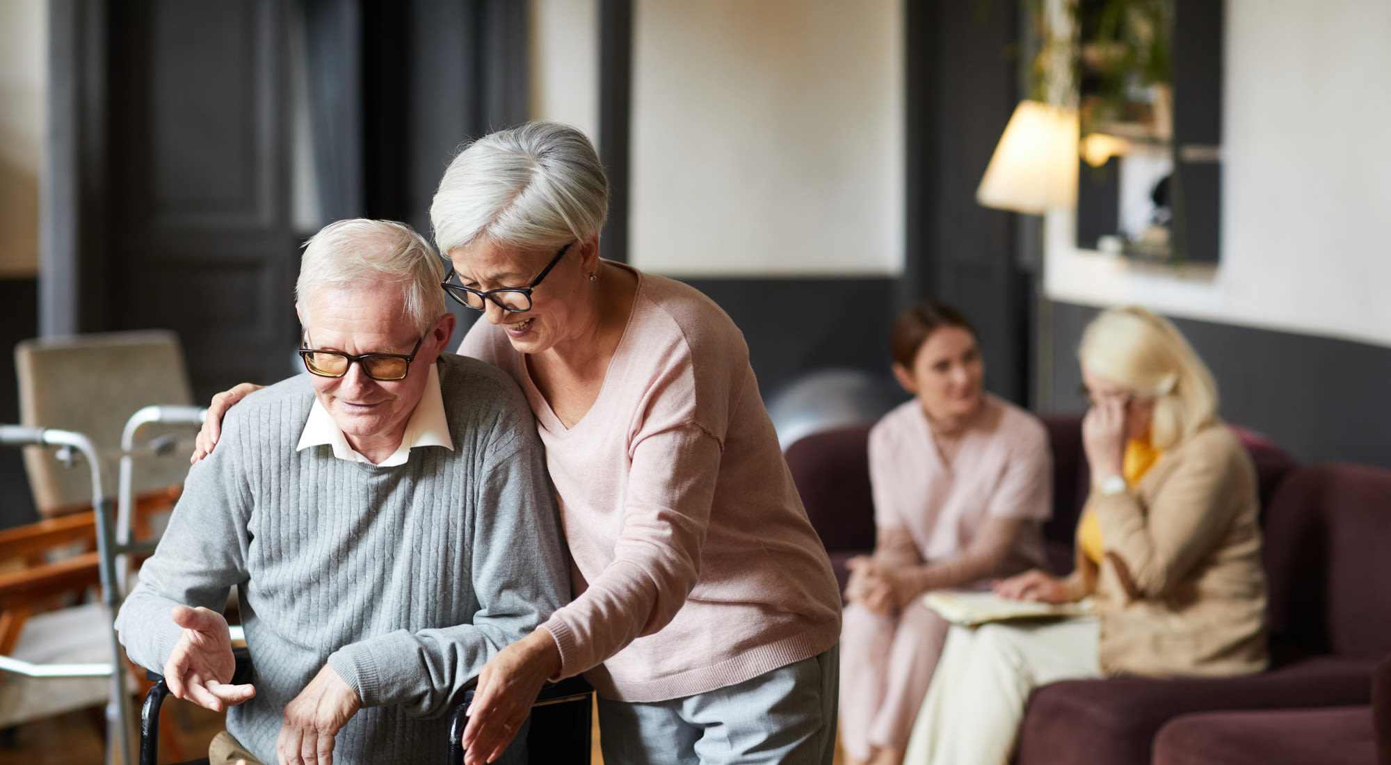 Residents interacting in a cozy common area